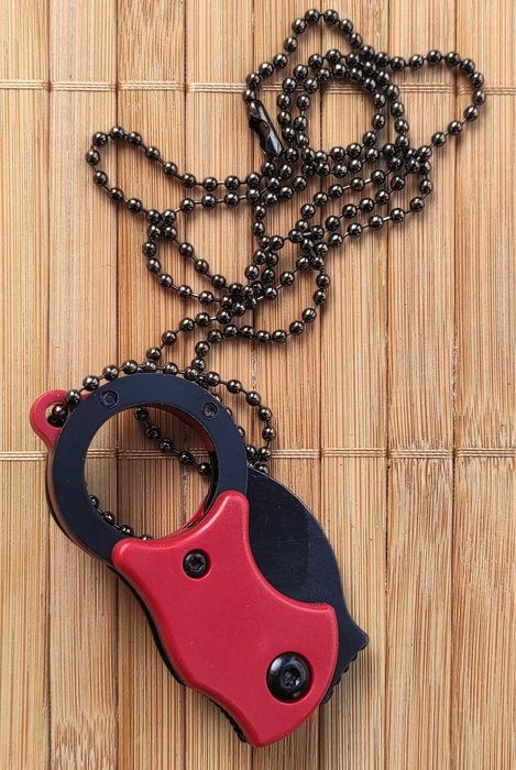 Сгъваемо ножче за носене на врата /36 грама/