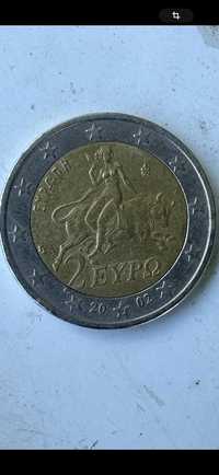 Moneda valoroasă de doi euro cu s în stea