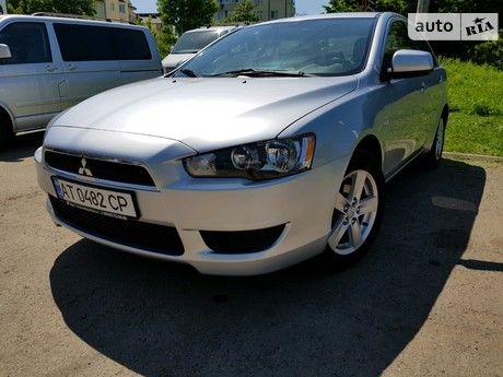 Бампер на Mitsubishi Lancer/Митсубиси Лансер 08-12 (целная решетка до)