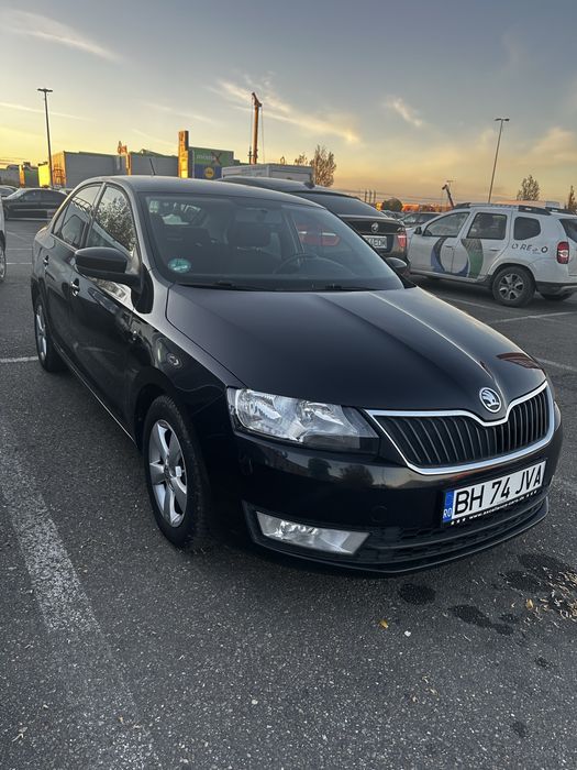 Skoda rapid culoarea neagra in stare buna