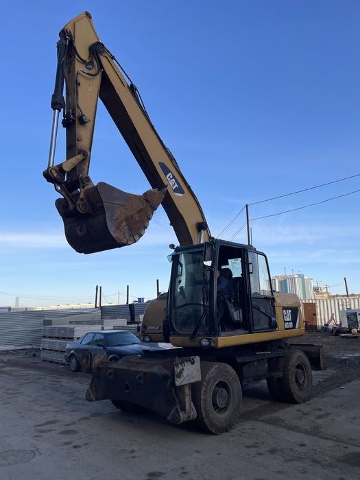 Продам колесный эксковатор CAT318