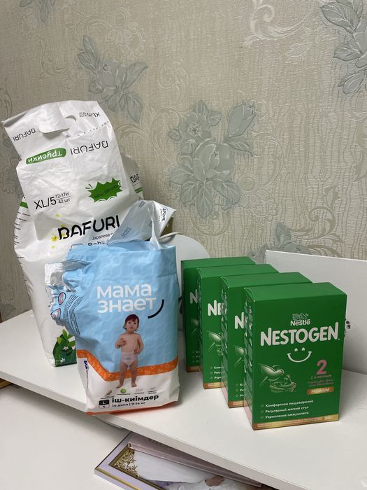 Продам смеси и подгузники