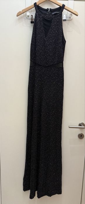 Блестящ гащеризон с прозрачни детайли и широки крачоли