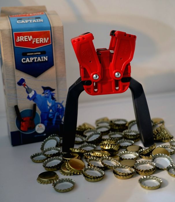 Уред за затваряне на бутилки с капачки