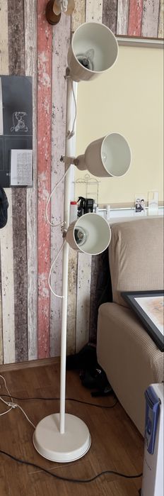 white IKEA Hektar floor lamp with 3-spotlights.