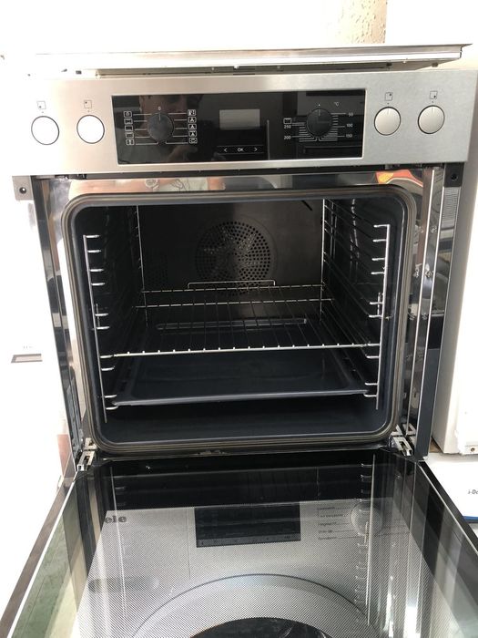 Фурна с идукционни котлони Miele за вграждане