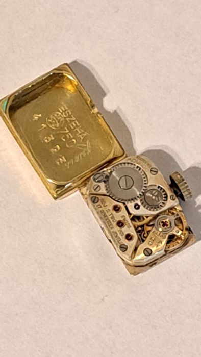 Mecanism plus capac de Aur 18 K Movado