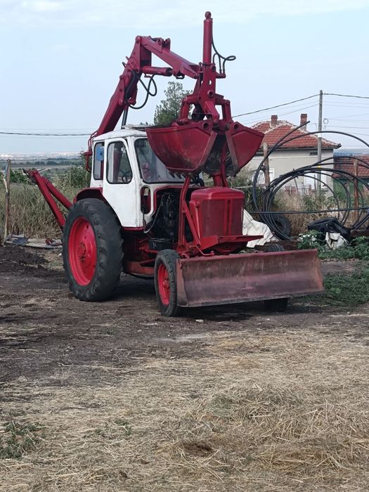 ЮМЗ с грайферен устройство