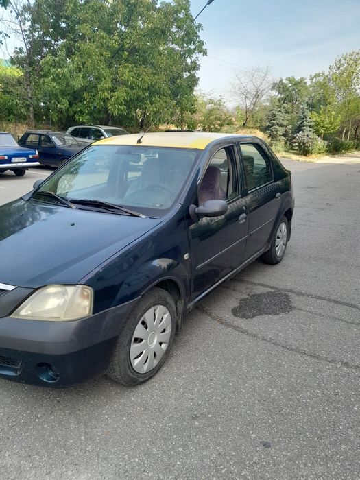 Vind Dacia Logan 1.4 benzina stare buna.