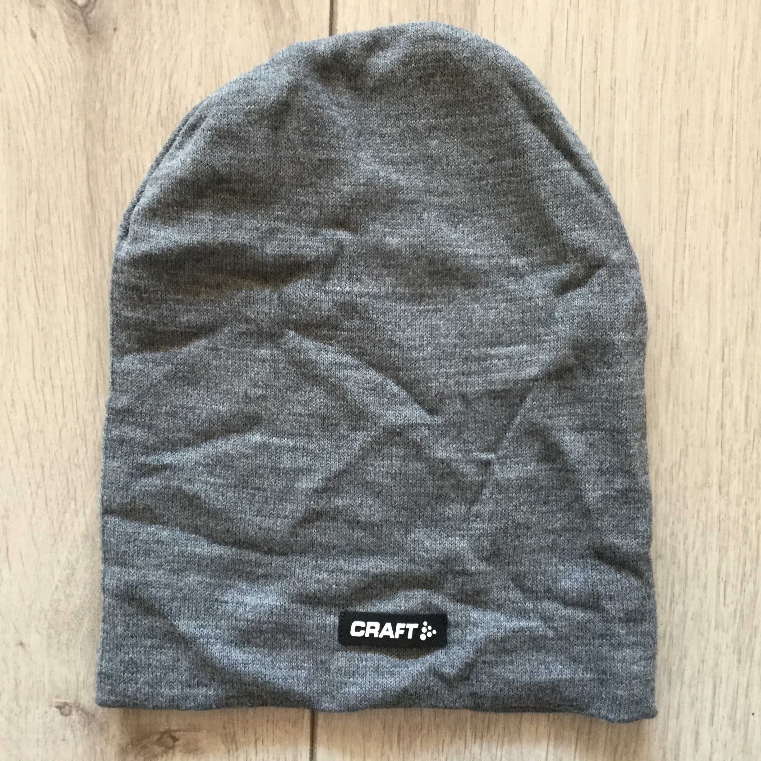 НОВА 100 % оригинална зимна плетена сива шапка CRAFT / Крафт за ски