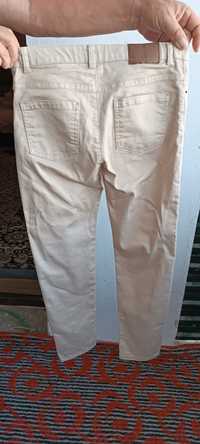 Продам джинсы бежевого цвета новые для 11-12 лет