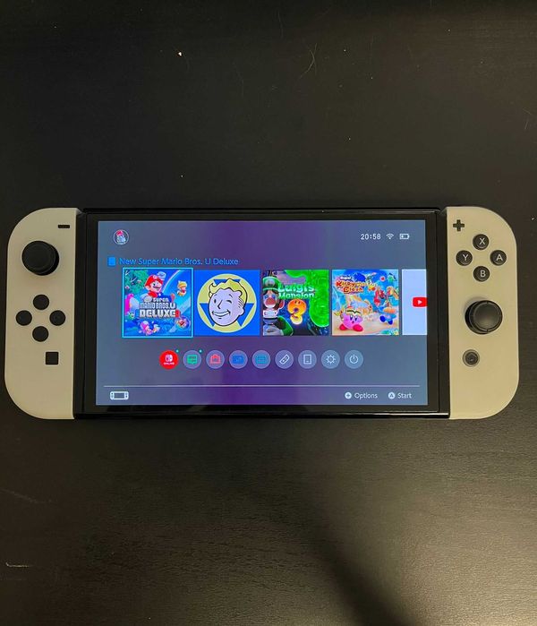 Nintendo Switch Oled + 2 jocuri