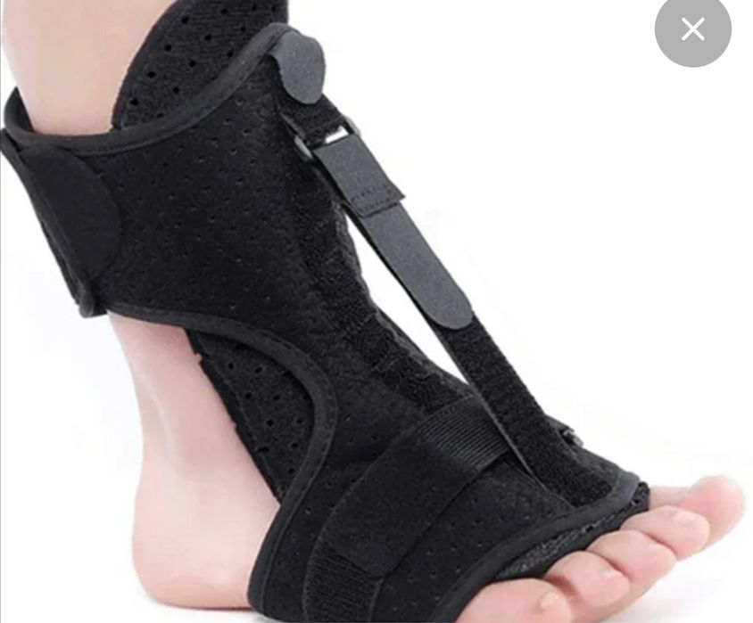 Регулируемый фиксатор для ног