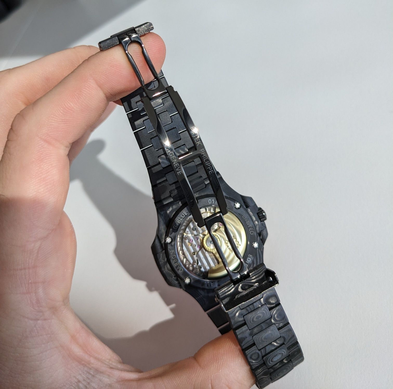 Patek Philippe Nautilus DiW Carbon – оранжев циферблат, пълен комплект