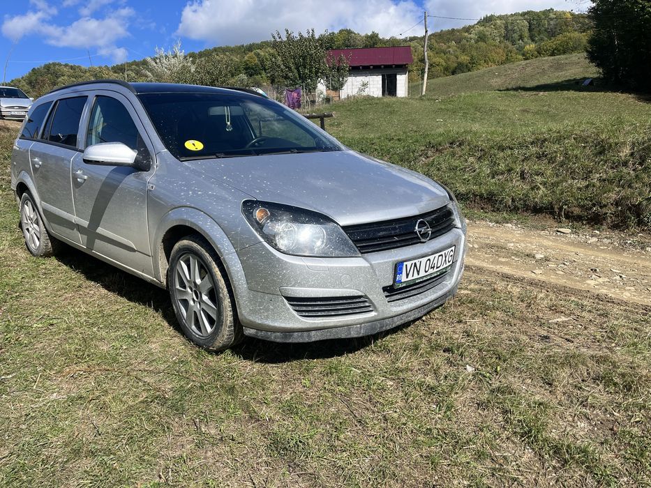 Vand sau schimb opel asta h  pret :2300€