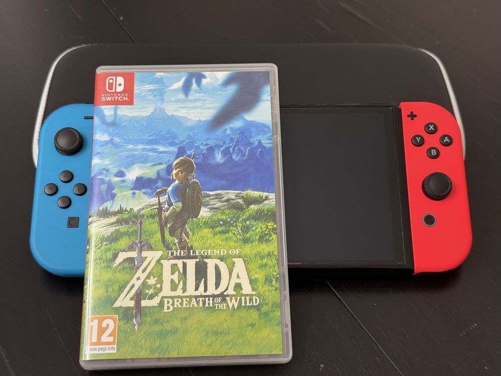 Nintendo Switch 64 GB OLEF 7” + Zelda The Breth of the Wild and Case