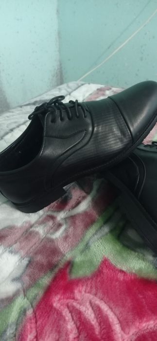 Yangi tufli kiyilmagan