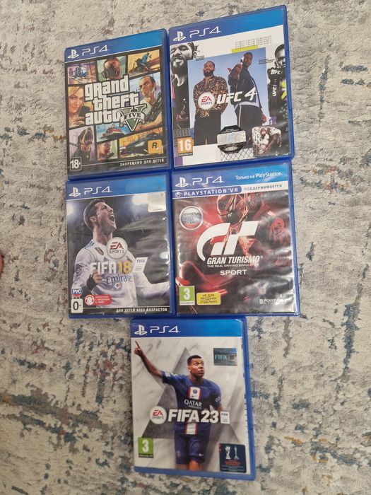 Продам б/у PS 4 с играми