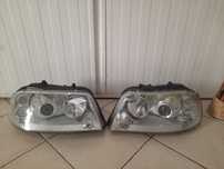 Vand far stanga+dreapta Original ptr.VW Sharan cu lupe si Xenon!
