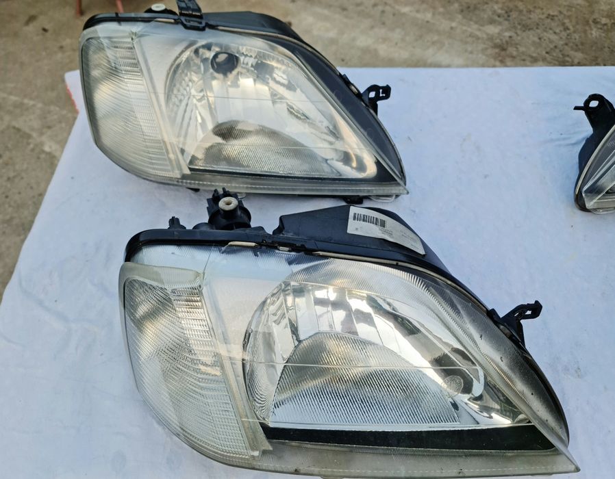 Faruri logan originale Elba (faza 1 ) și lampă spate