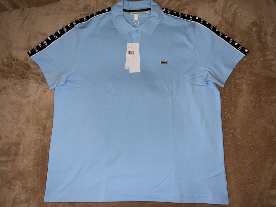 Поло Lacoste небесно-голубого цвета с лампасами, размер XXL.