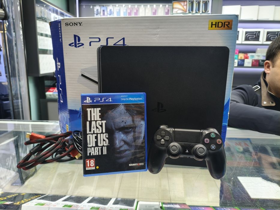 Продам б.у PLAYSTATION 4 slim 1tb с топ играми + 1joystick