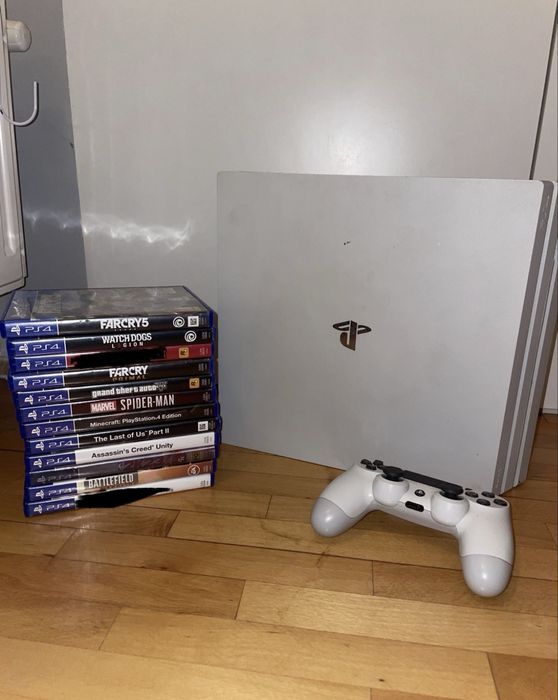Playstation 4 slim Alb 1 T + controller + 10 jocuri stare excelenta