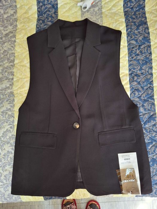 Продам пиджак без рукавов новый