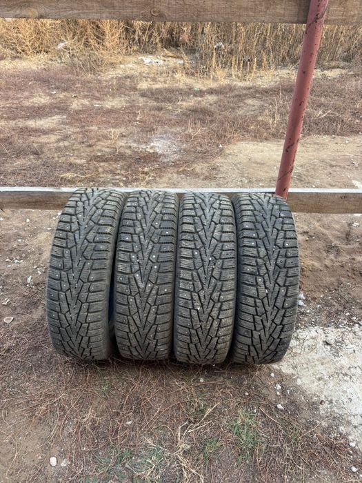 Продам зимнию шину с шипами
