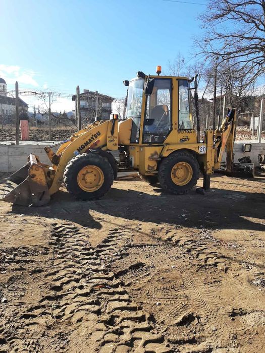 Багер Komatsu WB70A