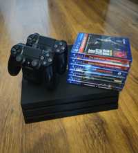 PlayStation 4 Pro 1Tb + 2 manete, 7 jocuri si un stand pentru manete.