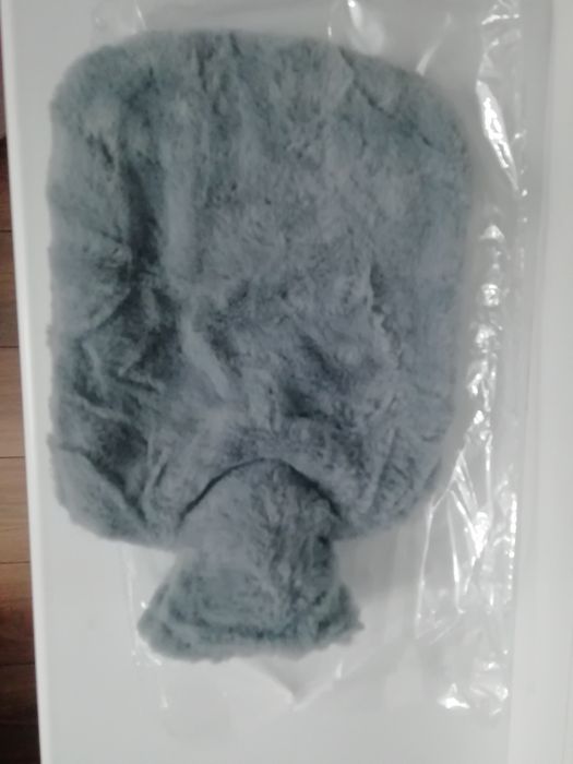 Новая грелка в меховом чехле.