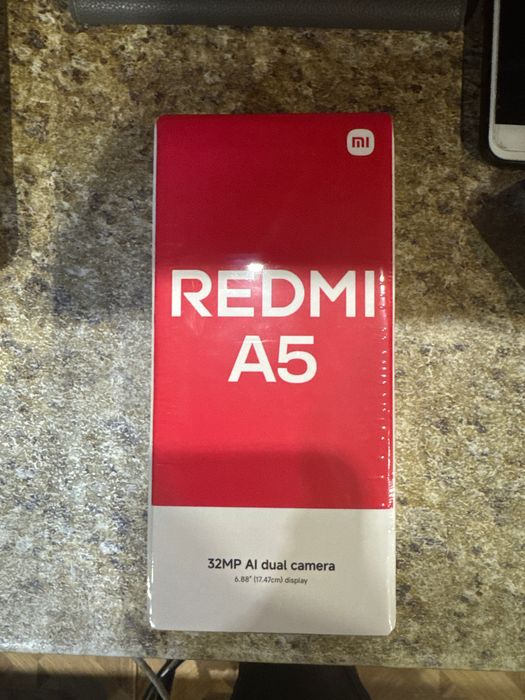 Продам телевон Редми А5