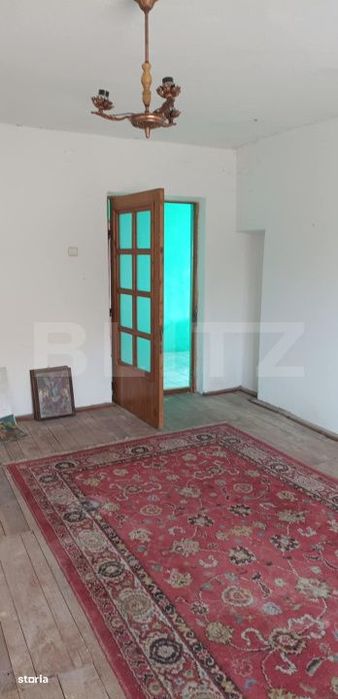 Casa cu 3 camere, bucatarie si baie, 105 mp si un teren de 1900 mp