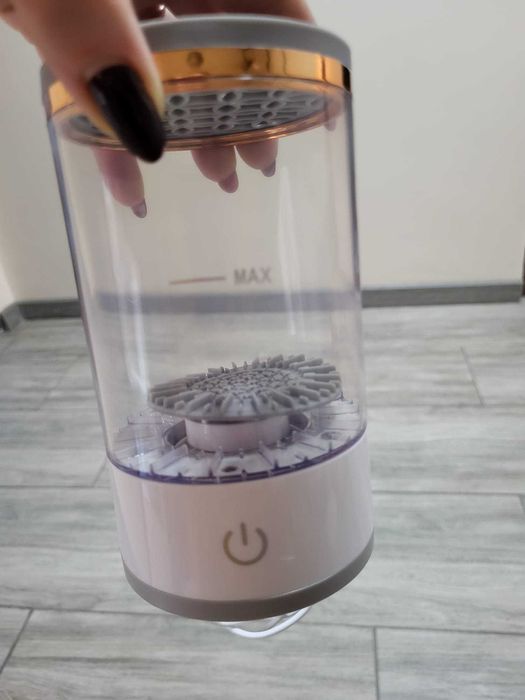 Aparat de curatat pensule