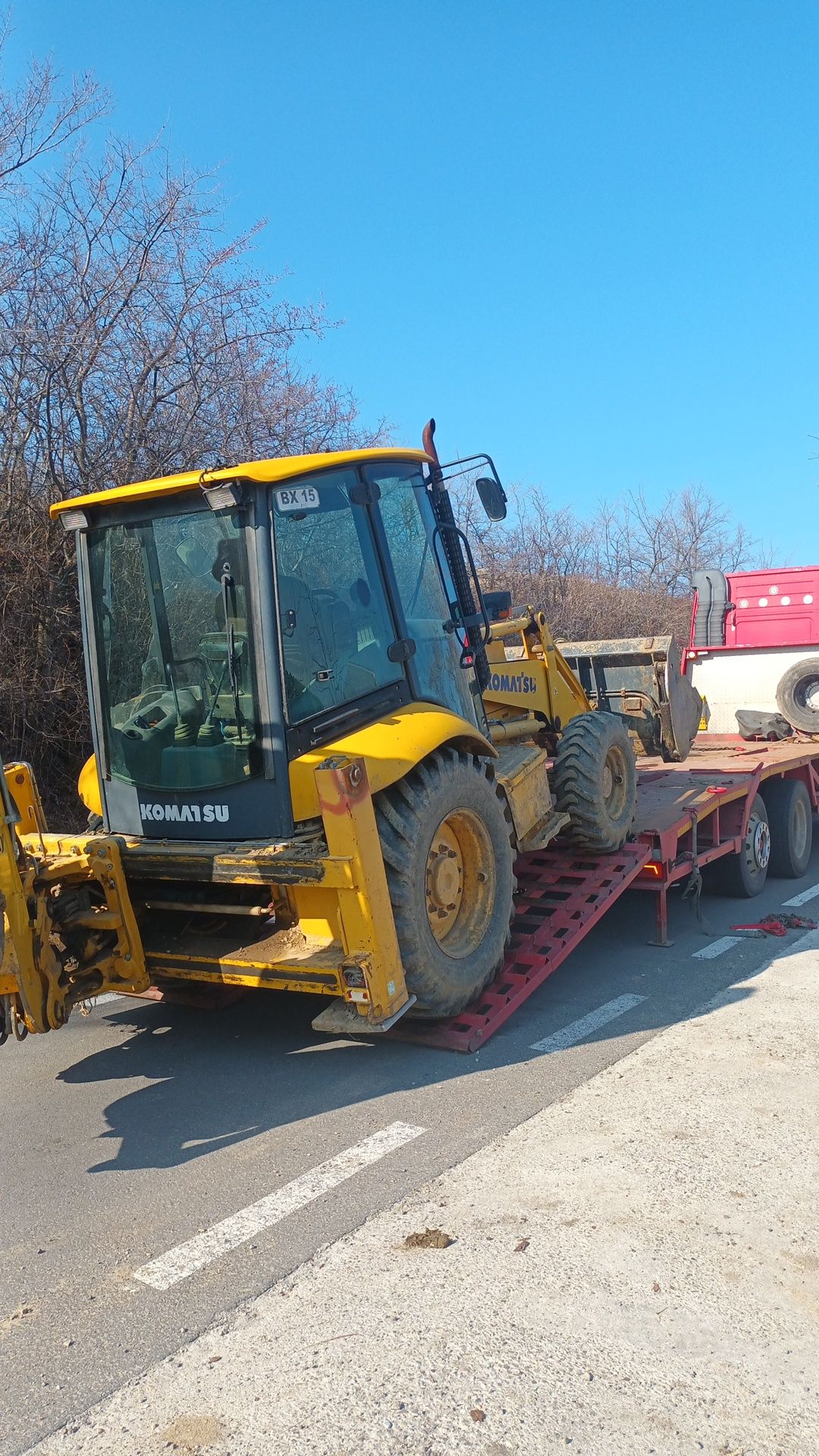 Transport buldoexcavator