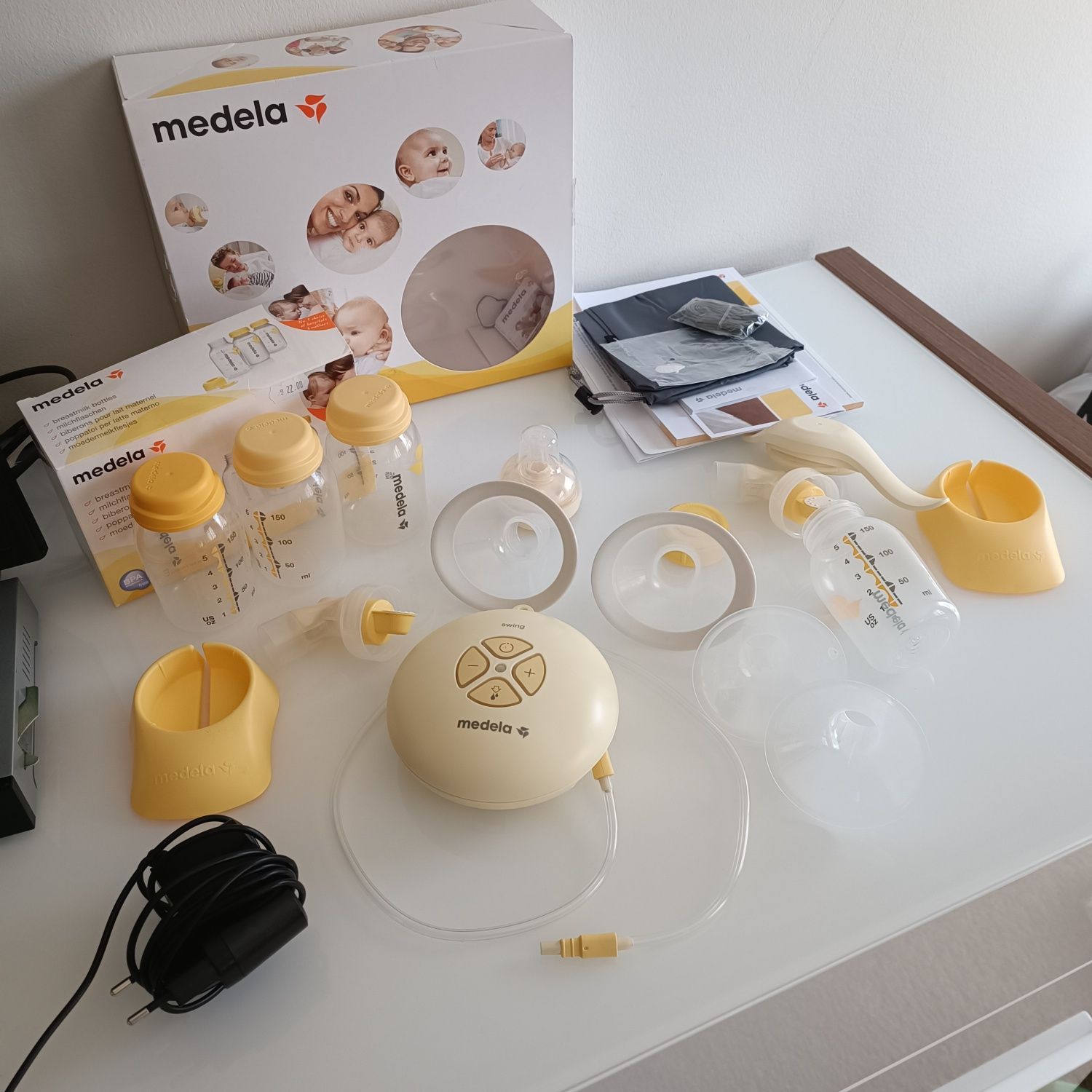 Medela Swing помпа за кърма, ръчна, електрическа и комплект шишета