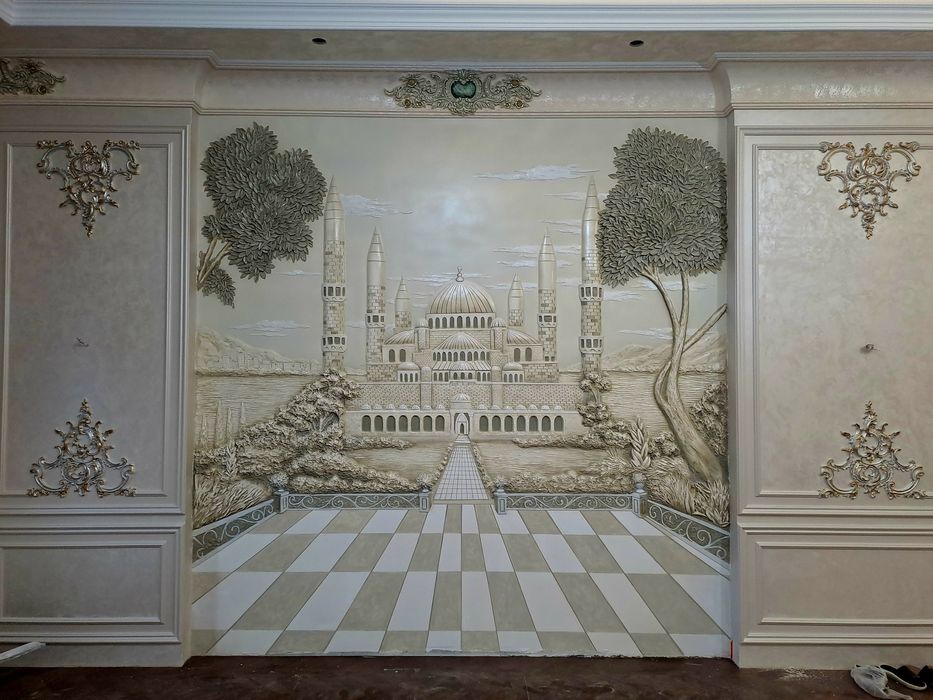 Rassom,Xudojnik,Devorga bo'rtma rasm.