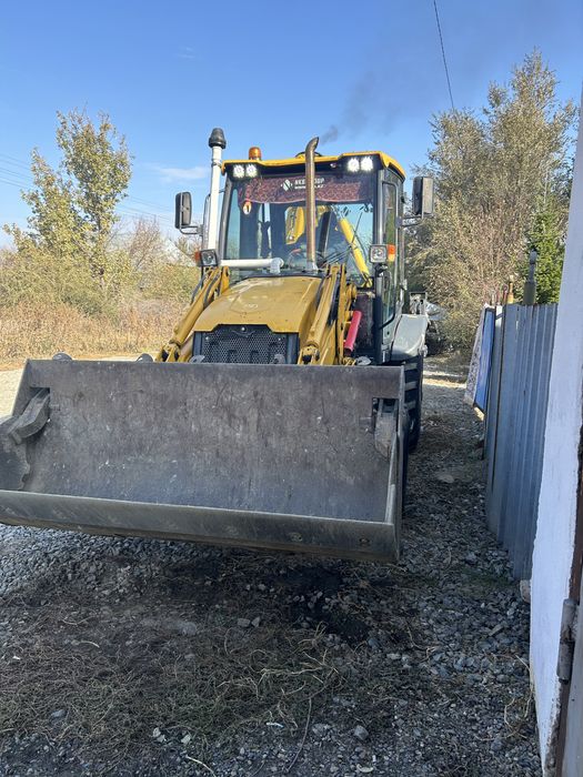 Услуги экскаватор-погрузчика