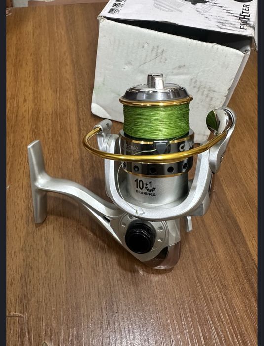 Daiwa Crossfie CS LT 2500-XH. В подарок вторая на фото.