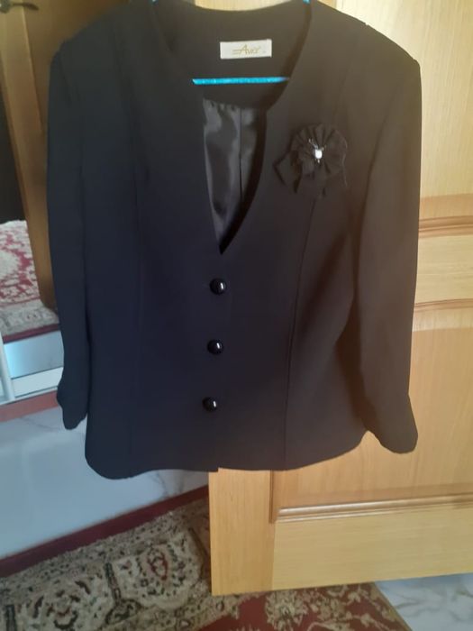 Женский костюм .