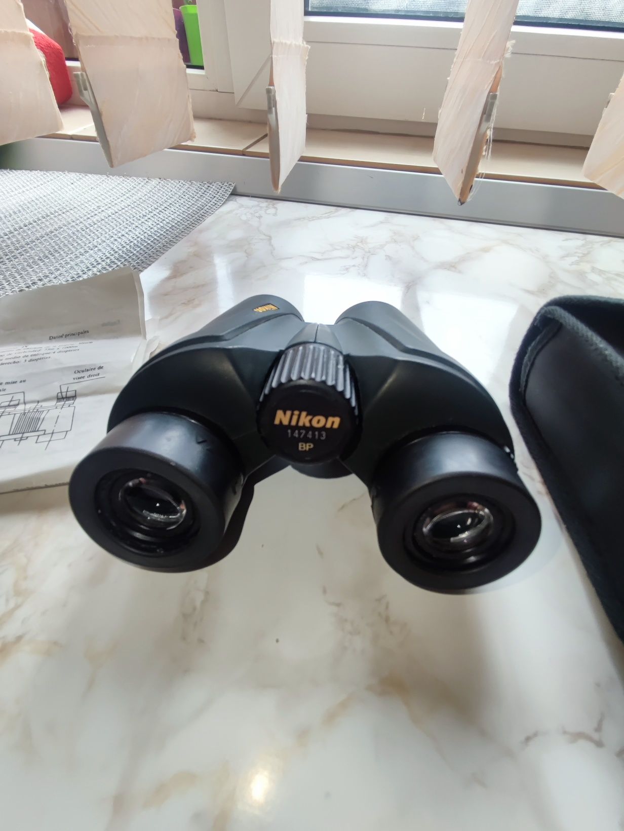 BINOCLU NIKON 
Detalii conținut