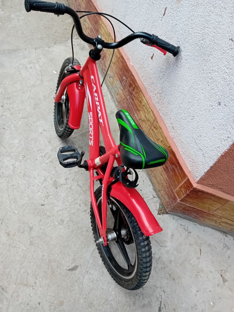Bicicleta ptr.copii4-8 ani cu roti de 16 inci si roti ajutatoare.