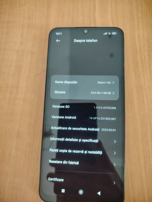 Redmi 14 c spart pe spate, dar în stare foarte bună de funcționare