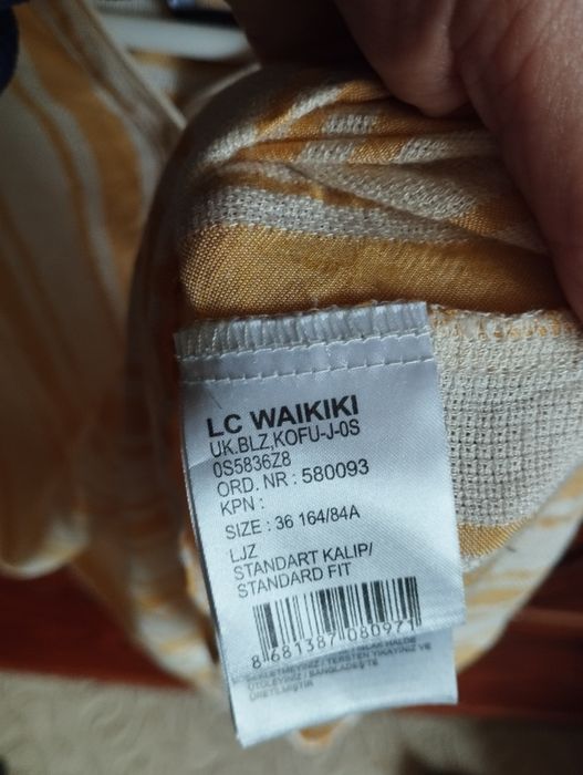 Bluză de culoare bej cu dungi verticale de culoare galbenă, mărimea 36