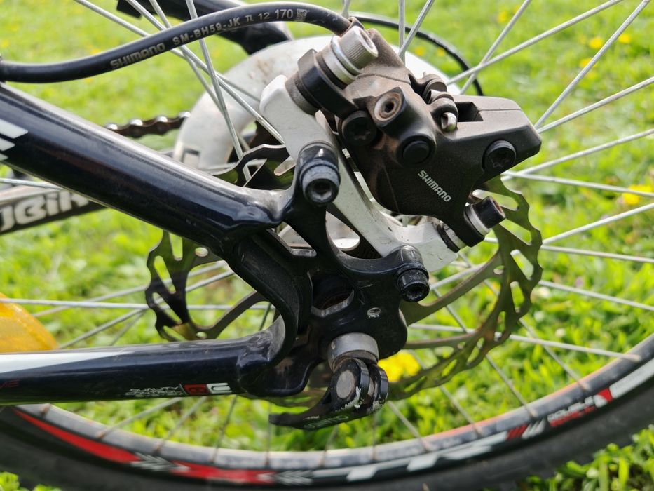 Bicicletă MTB 24", cadru aluminiu, frâne hidraulice pe disc