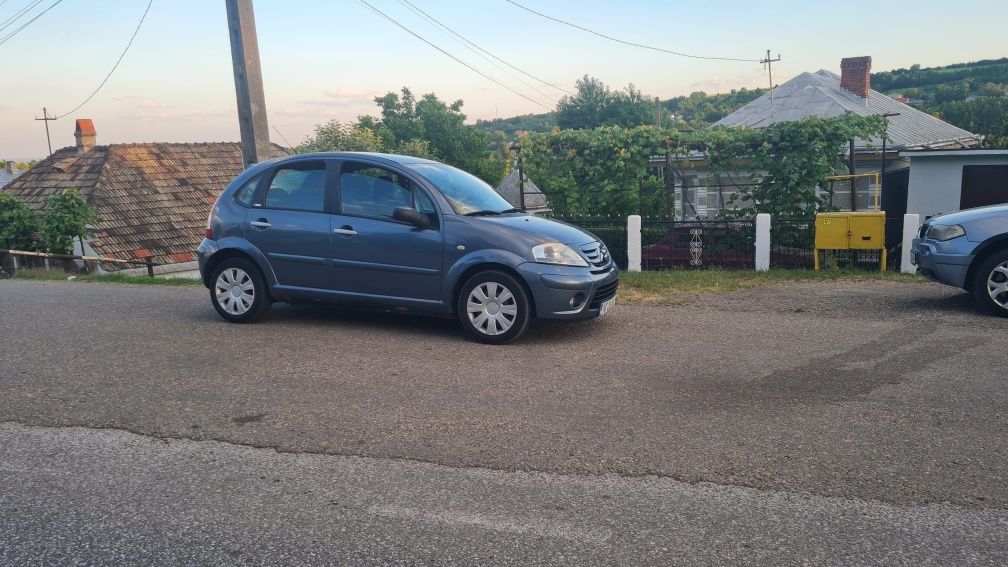 Citroen C3 model exclusive an 2009 1.4 diesel  comenzi volan consum mi