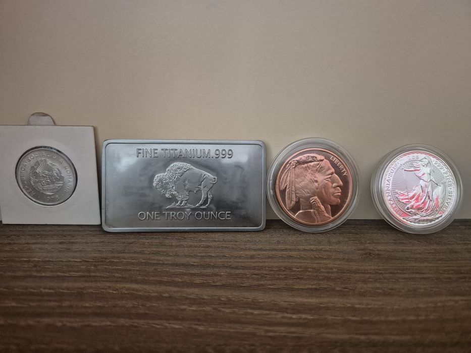 Monede lingou: cupru, aluminiu, titaniu, argint (1oz/31,1g)